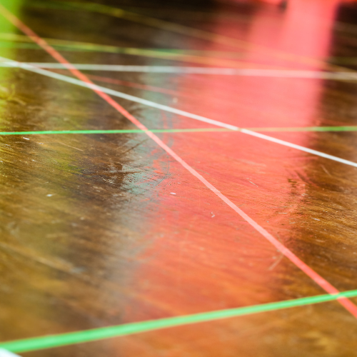A wooden floor with strobe lights.