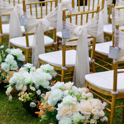 FurnitureWedding chairs setup outdoors on a clear day.