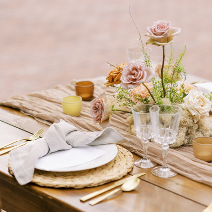 TablewareA set table with plateware flowers and glassware.